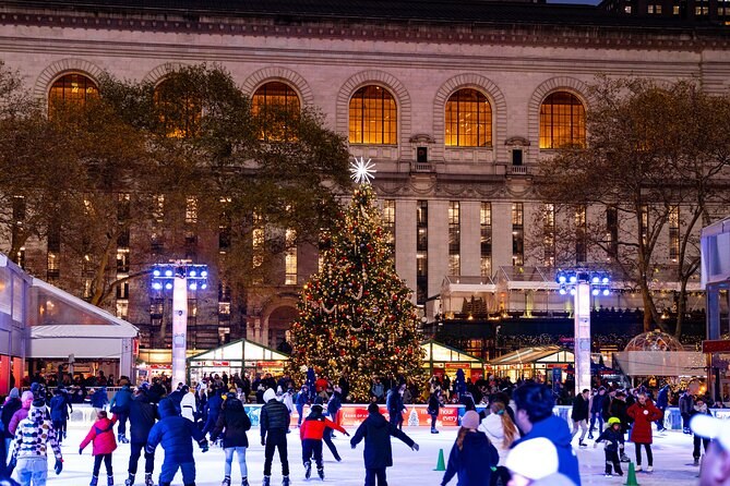 The free-admission ice rink at Bryant Park's Winter Village with the market kiosks around it