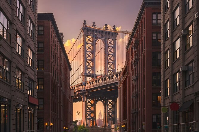 The Manhattan Bridge framed between the brick warehouses of Washington Street in DUMBO
