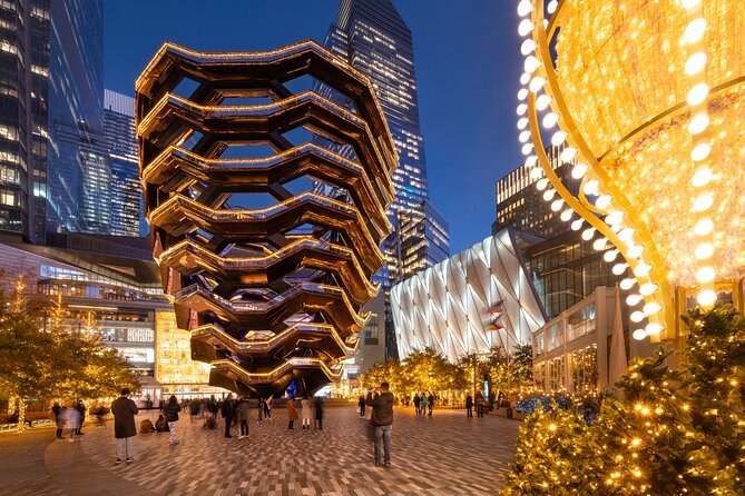 The Vessel at Hudson Yards lit from within against the evening sky